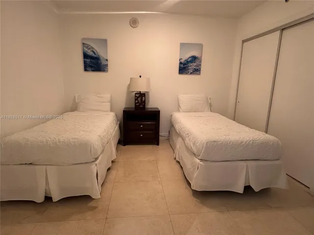 a bathroom with a double vanity sink toilet and shower