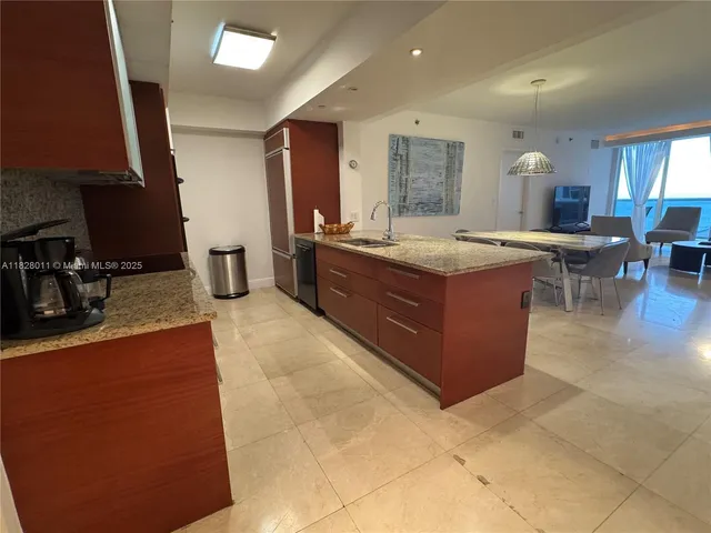 a view of a dining table and chairs in the room