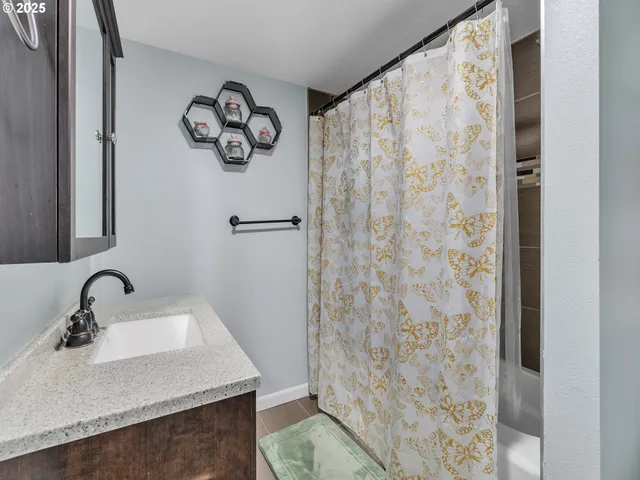 a bathroom with a sink and a mirror