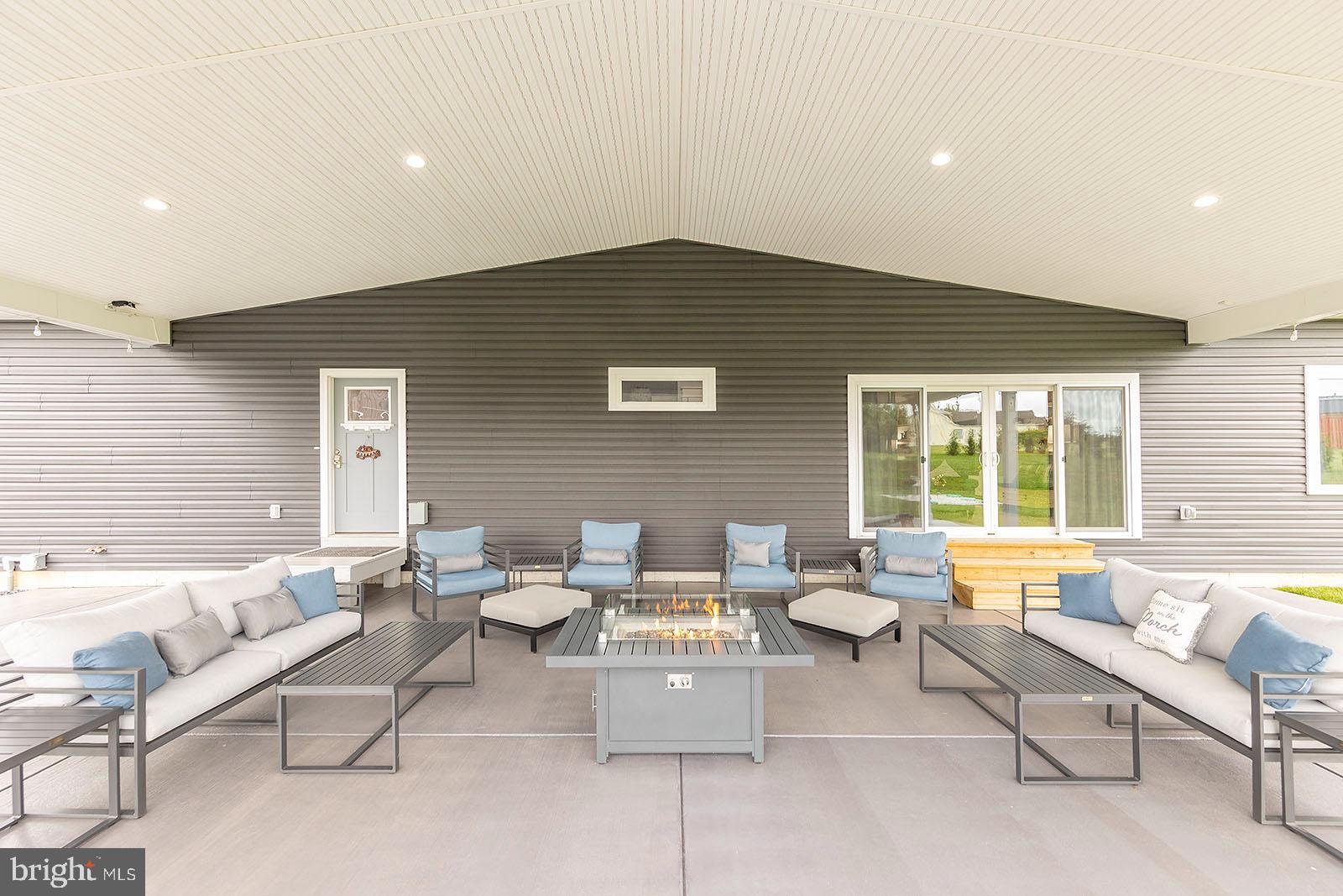 158 Riding Chapel Road Stephens City, VA 22655 - Photo 42 of 54 This covered patio is an entertainer's dream