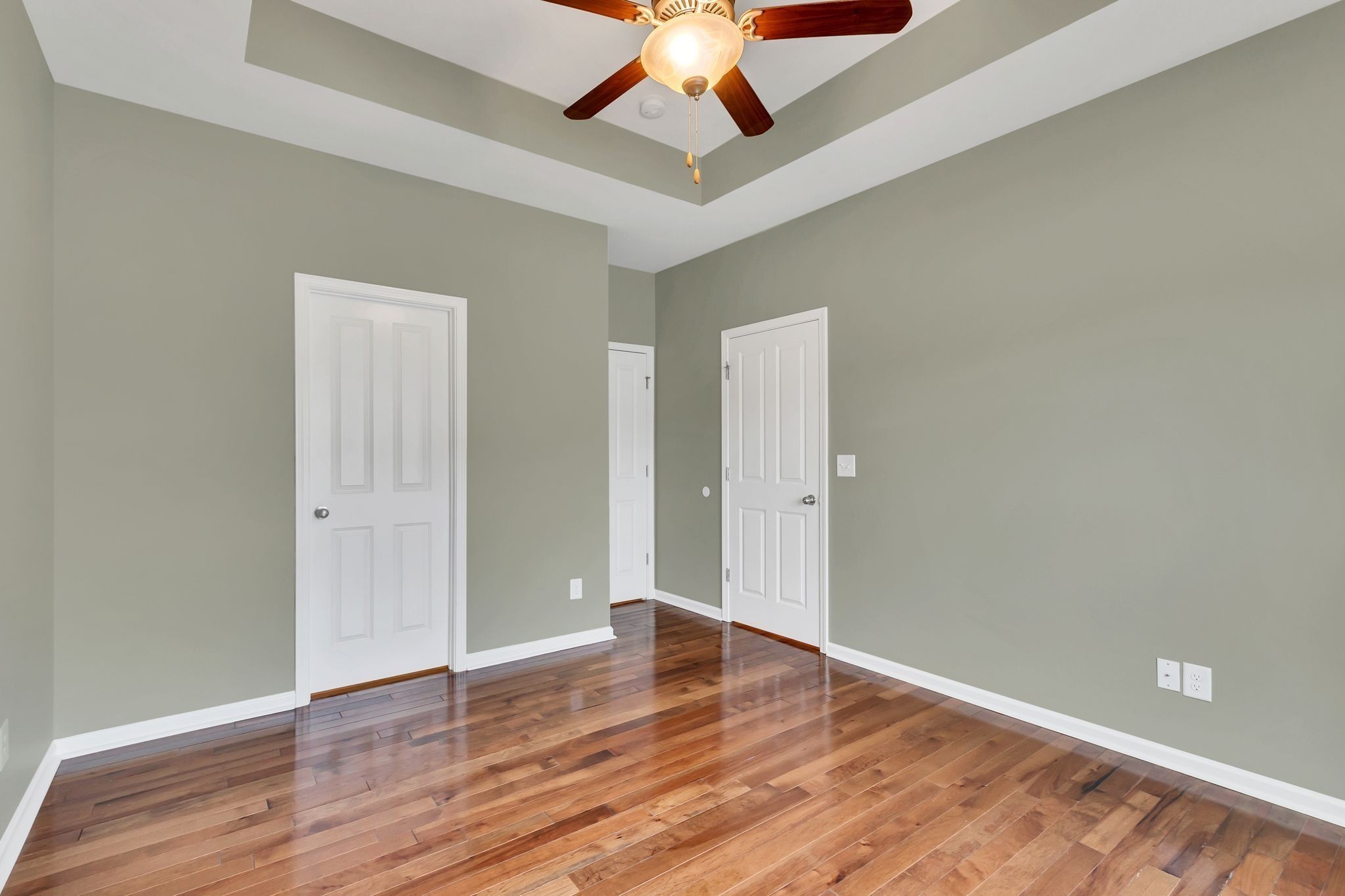 305 Dursley Lane Spring Hill, TN 37174 - Photo 17 of 25 an empty room with wooden floor chandelier fan and closet area