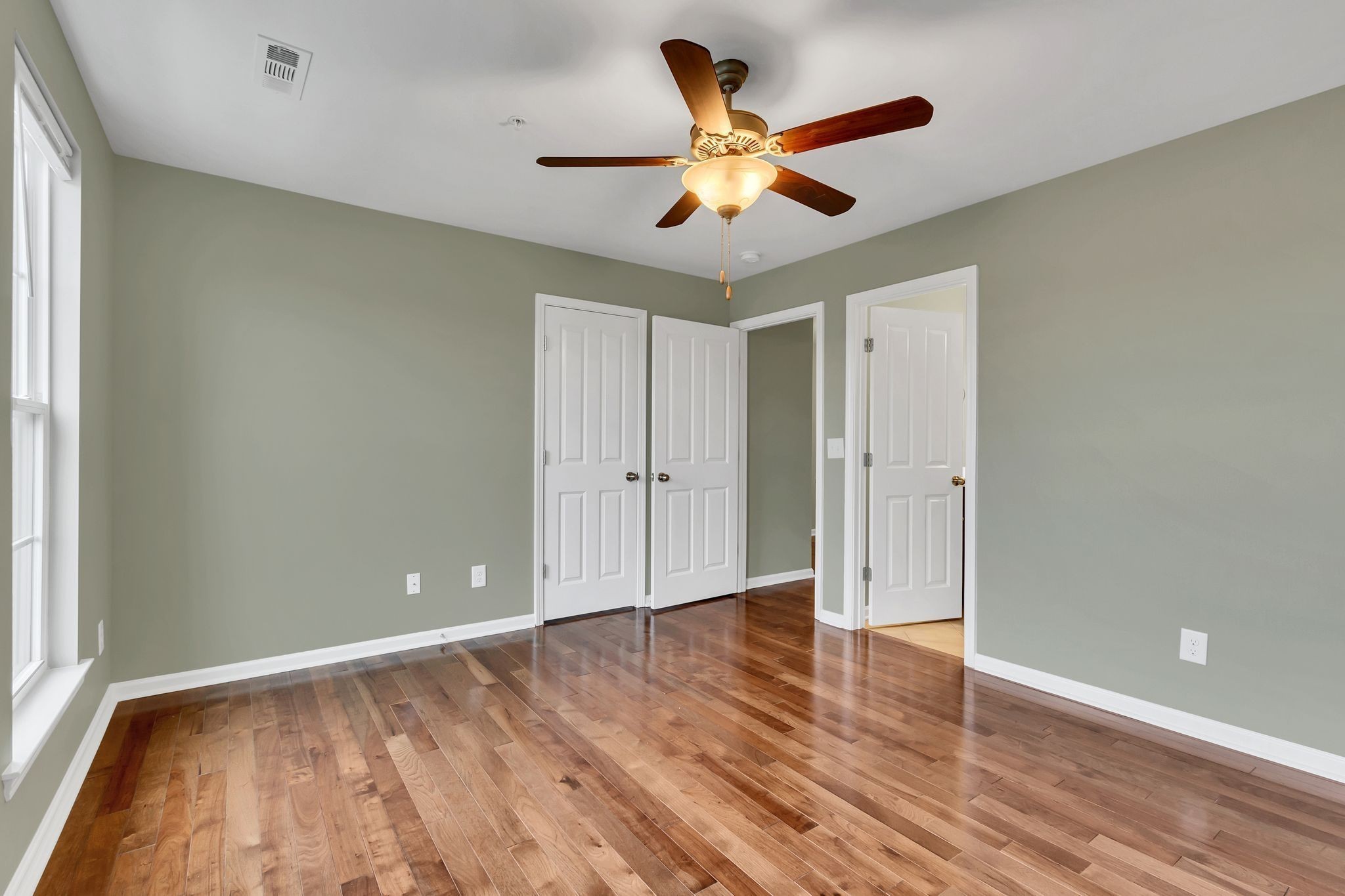 305 Dursley Lane Spring Hill, TN 37174 - Photo 19 of 25 wooden floor in an empty room with a window