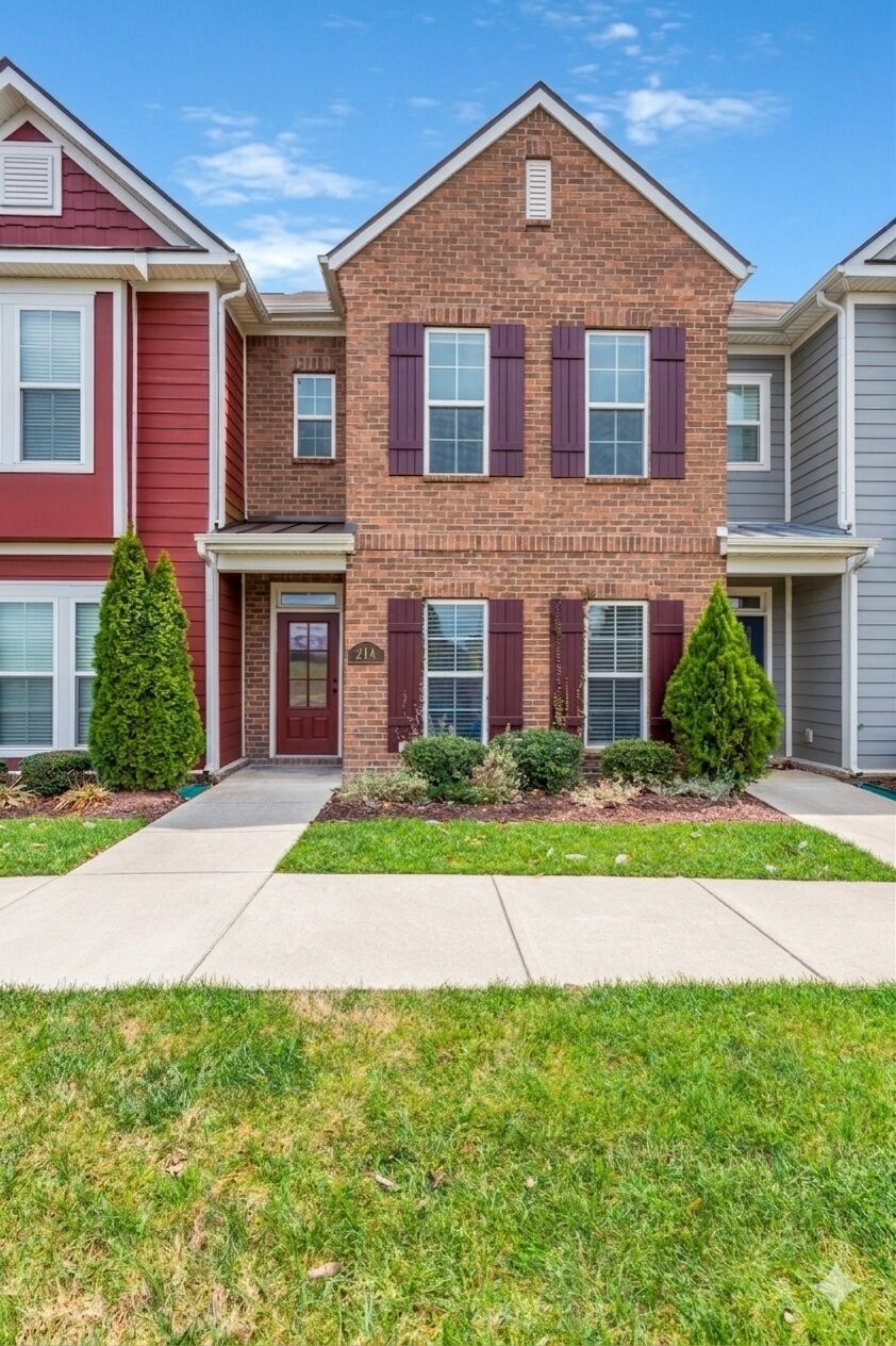 305 Dursley Lane Spring Hill, TN 37174 - Photo 2 of 25 a front view of a house with a yard