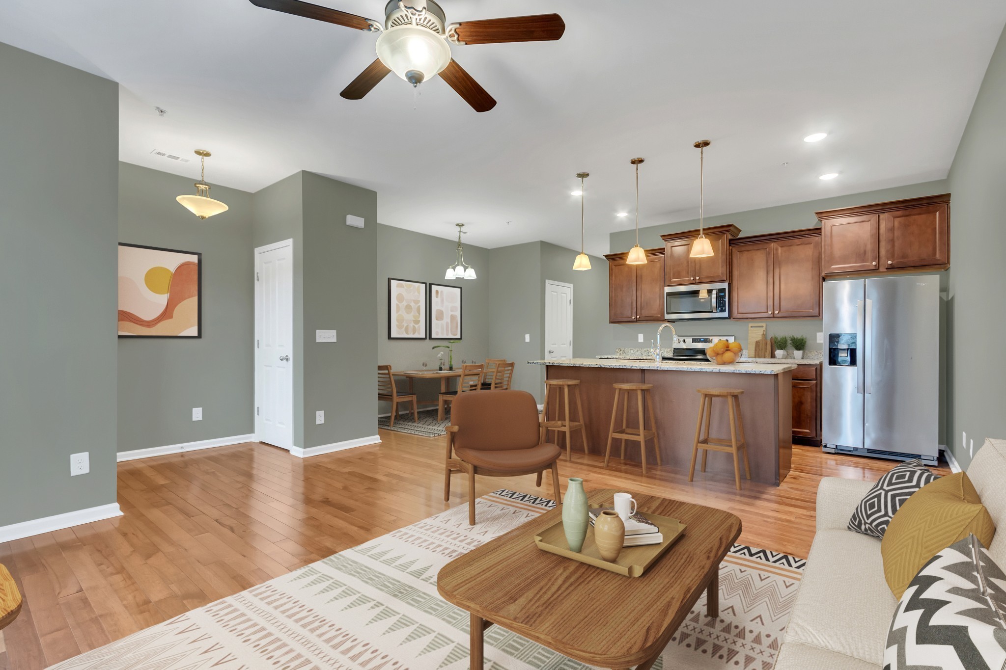 305 Dursley Lane Spring Hill, TN 37174 - Photo 4 of 25 a living room with stainless steel appliances kitchen island granite countertop furniture and a view of kitchen