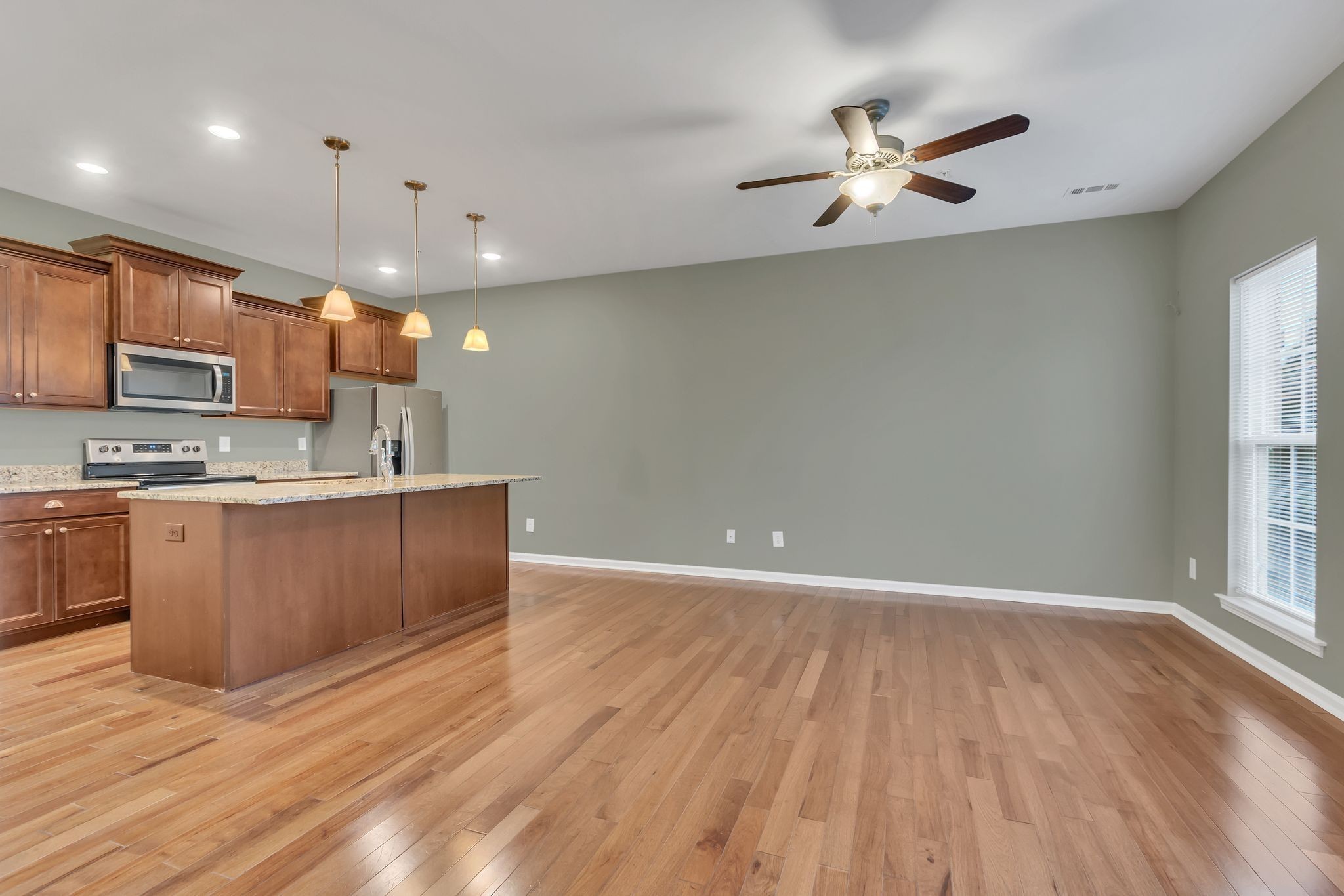 305 Dursley Lane Spring Hill, TN 37174 - Photo 5 of 25 a view of kitchen with granite countertop cabinets and window