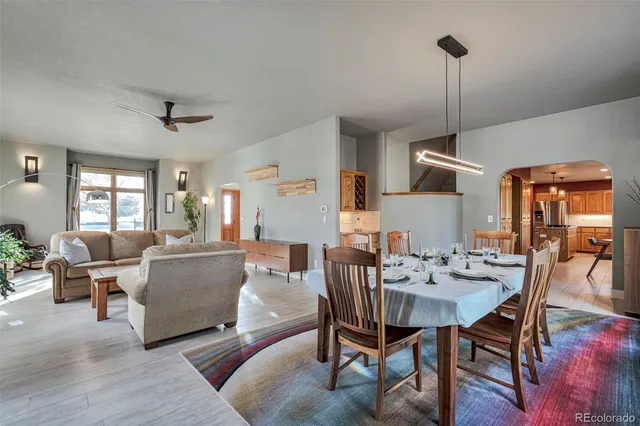 a view of a dining room with furniture window and wooden floor
