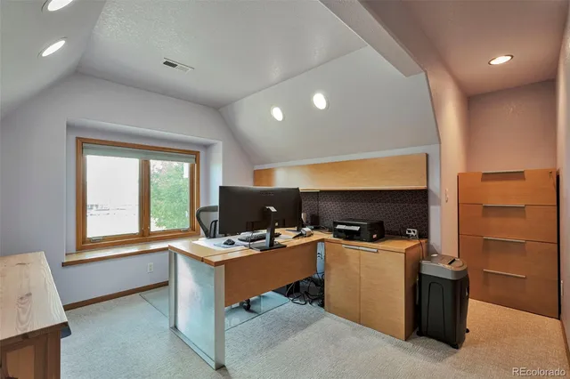 a workspace with furniture and window