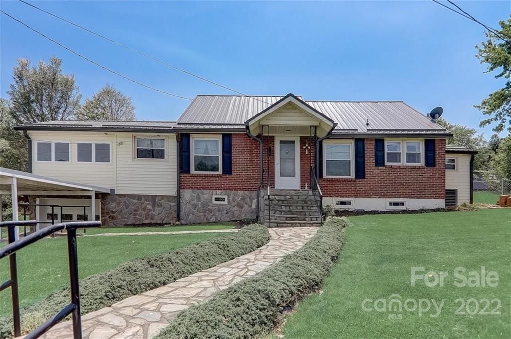 115 Substation Road Canton, NC 28716 - Photo 1 of 41 a front view of a house with a yard