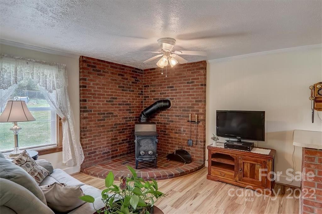 115 Substation Road Canton, NC 28716 - Photo 11 of 41 a living room with furniture and a flat screen tv