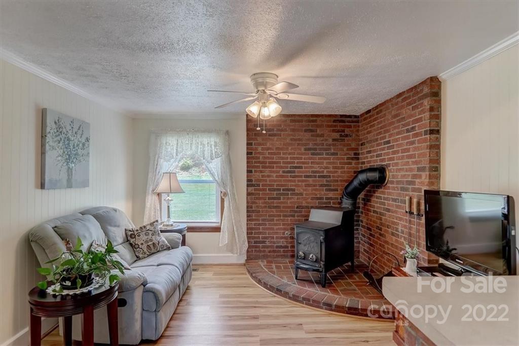 115 Substation Road Canton, NC 28716 - Photo 12 of 41 a living room with furniture and a flat screen tv