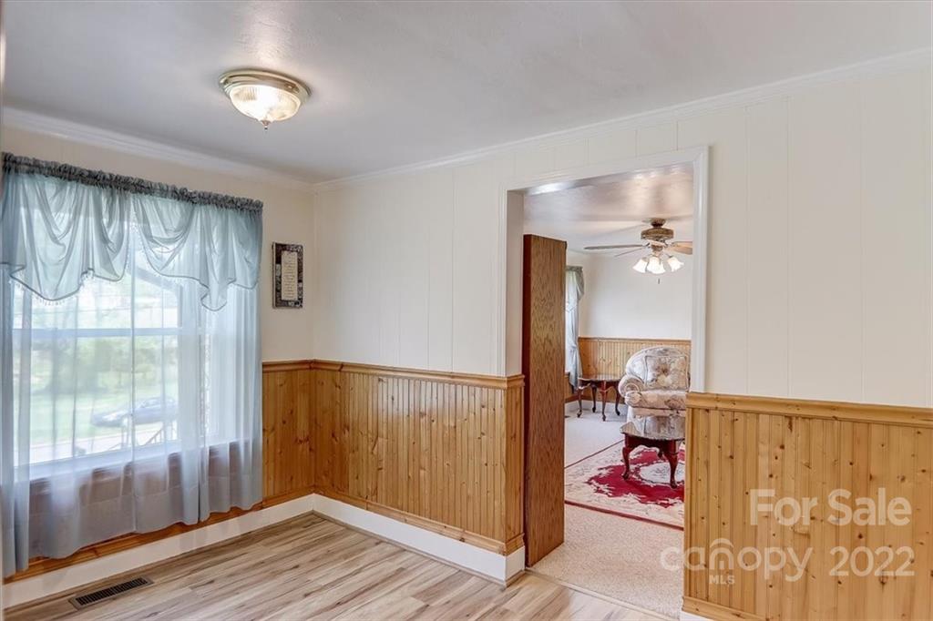 115 Substation Road Canton, NC 28716 - Photo 17 of 41 a view of a room with wooden floor and windows