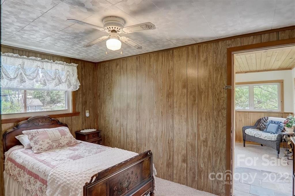 115 Substation Road Canton, NC 28716 - Photo 25 of 41 a bedroom with a bed and a window