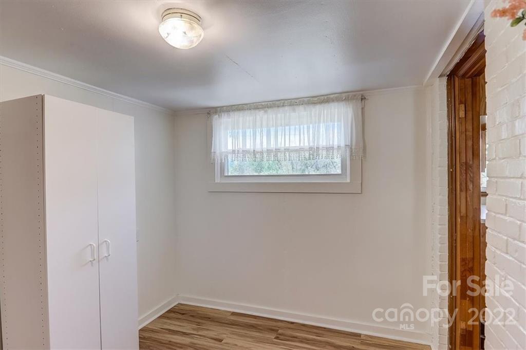 115 Substation Road Canton, NC 28716 - Photo 29 of 41 a view of an empty room with a window