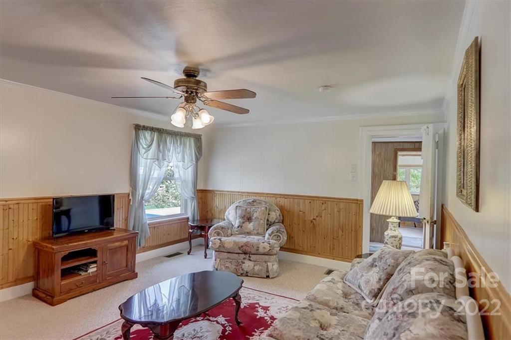 115 Substation Road Canton, NC 28716 - Photo 32 of 41 a living room with furniture and a flat screen tv