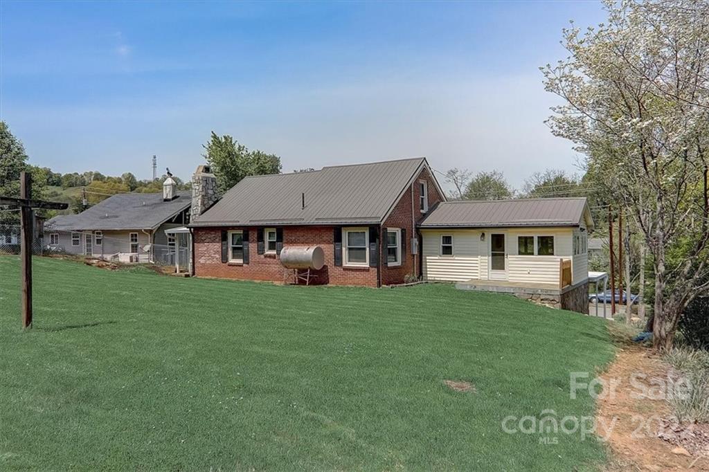 115 Substation Road Canton, NC 28716 - Photo 34 of 41 a view of a house with a big yard