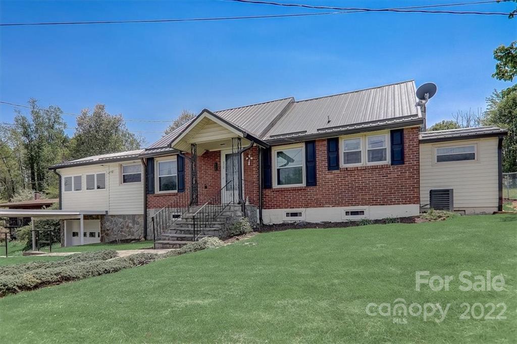 115 Substation Road Canton, NC 28716 - Photo 38 of 41 a front view of a house with a garden