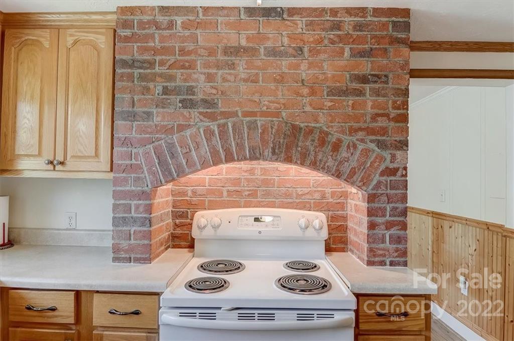 115 Substation Road Canton, NC 28716 - Photo 40 of 41 a stove top oven sitting inside of a kitchen