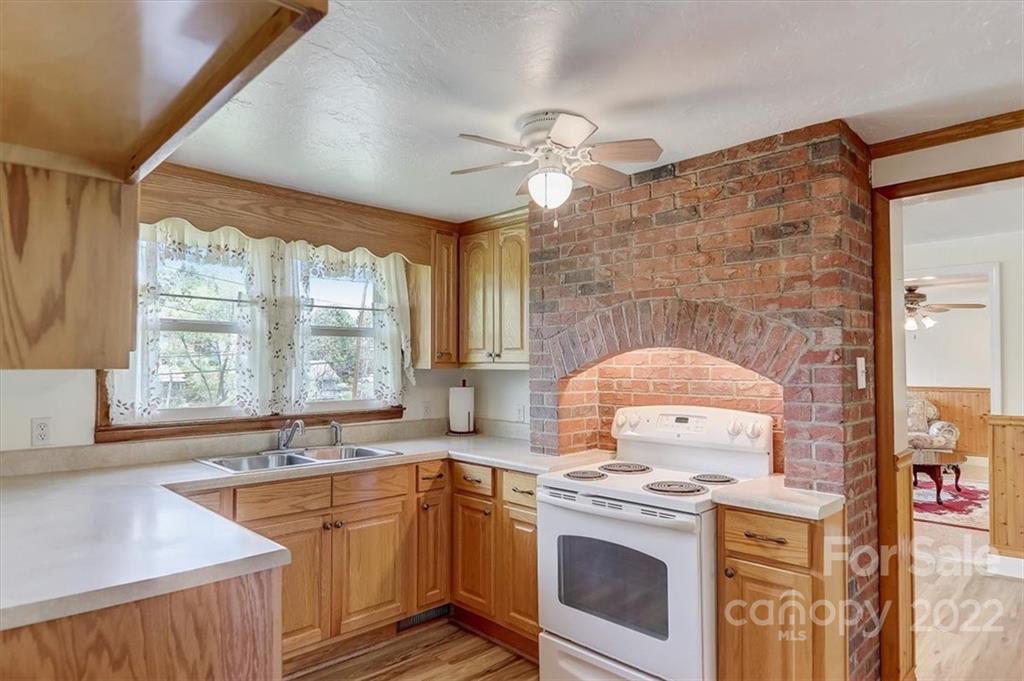 115 Substation Road Canton, NC 28716 - Photo 8 of 41 a kitchen with a stove and a sink