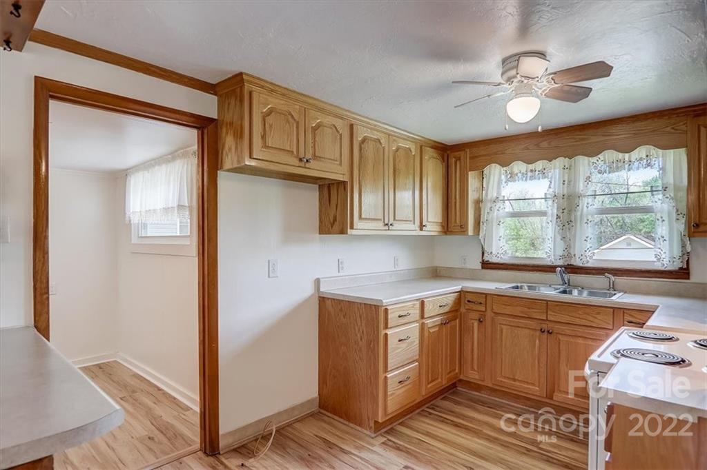 115 Substation Road Canton, NC 28716 - Photo 10 of 41 a kitchen with a sink stove and cabinets