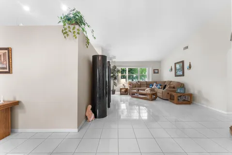 a kitchen with stainless steel appliances a refrigerator sink and microwave
