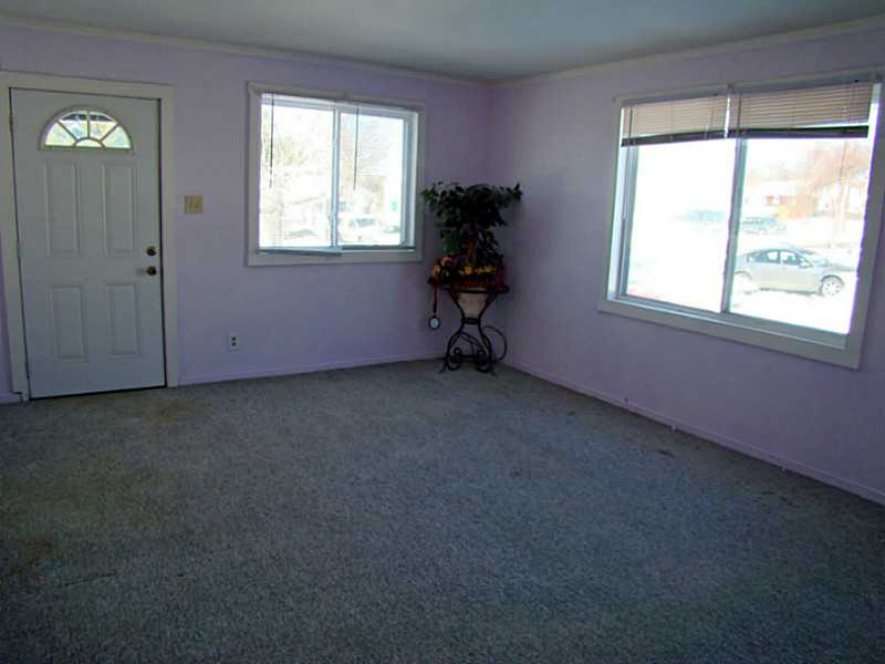 11 Ludlow Road Middletown, RI 02842 - Photo 15 of 24 Living Room. 1 BR Unit Living Room has nice light from large windows.