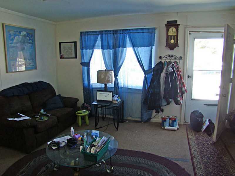 11 Ludlow Road Middletown, RI 02842 - Photo 21 of 24 Living Room. 2 BR Unit Living Room. Front Door to right.