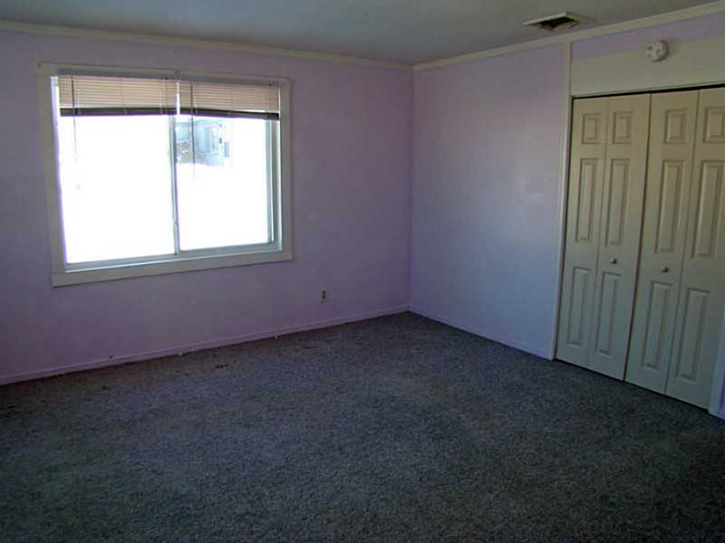 11 Ludlow Road Middletown, RI 02842 - Photo 6 of 24 Living Room. 1 BR Unit Living Room has large windows and double coat closet.