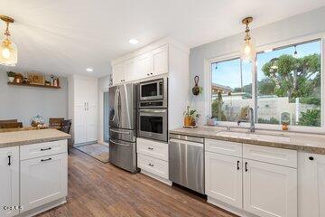 10 Rio Via Oak View, CA 93022 - Photo 10 of 19 a kitchen with a sink stove and refrigerator