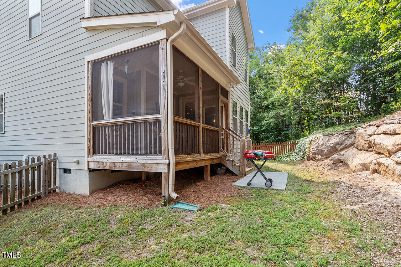 3051 Freeman Farm Way Rolesville, NC 27571 - Photo 34 of 37 Screened porch and partially fenced yard. Additional space available on left side of the property for gardening or play opportunities