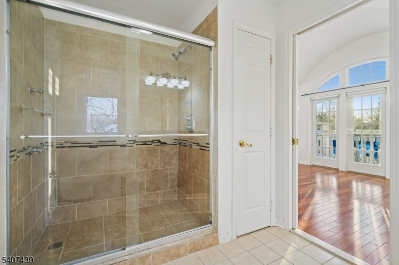 282 South Street, Unit B New Providence, NJ 07974 - Photo 20 of 28 a bathroom with a glass shower door