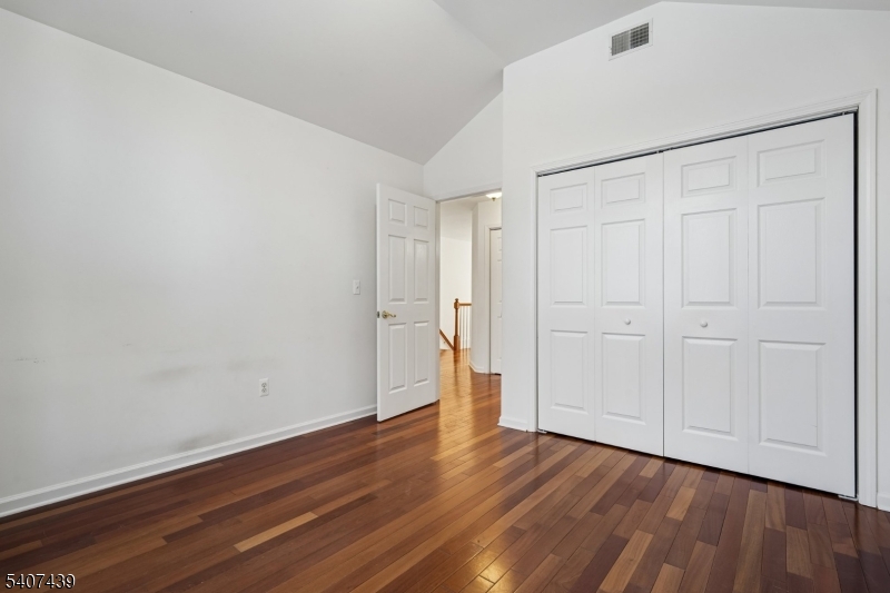 282 South Street, Unit B New Providence, NJ 07974 - Photo 21 of 28 a view of an empty room with wooden floor