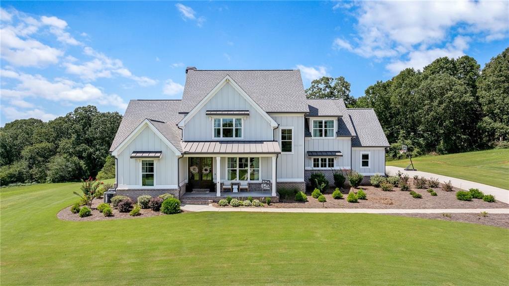815 North Hampton Way Monroe, GA 30656 - Photo 1 of 89 a front view of house with yard and outdoor seating