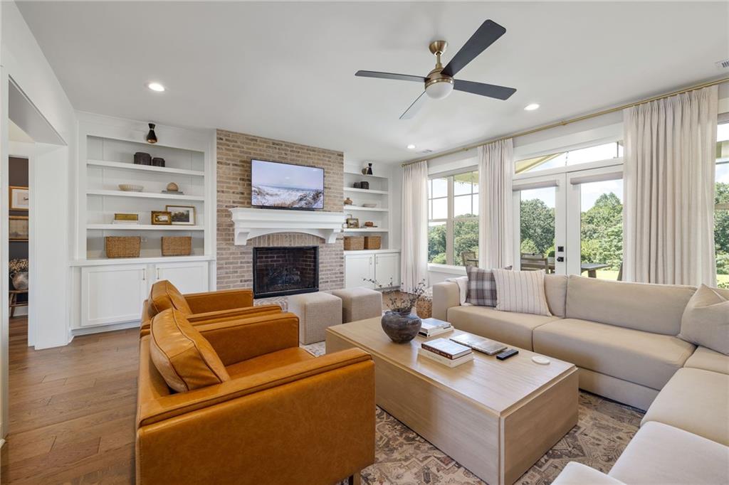 815 North Hampton Way Monroe, GA 30656 - Photo 14 of 89 a living room with furniture a fireplace and a large window