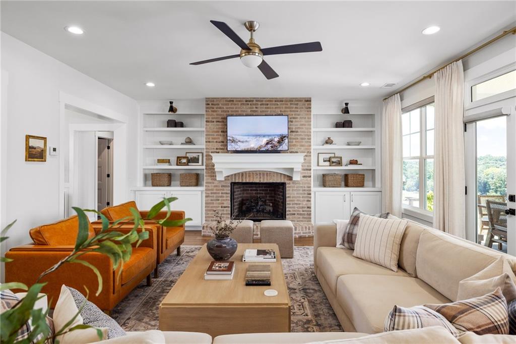 815 North Hampton Way Monroe, GA 30656 - Photo 15 of 89 a living room with furniture ceiling fan and a fireplace