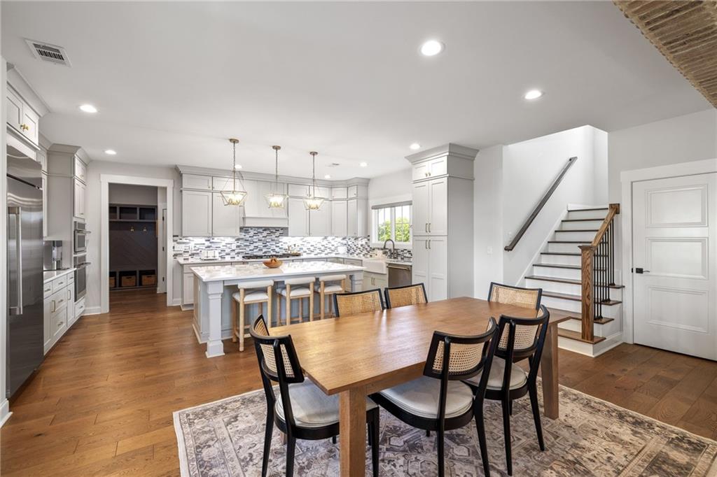 815 North Hampton Way Monroe, GA 30656 - Photo 17 of 89 a dining room with furniture and a kitchen view