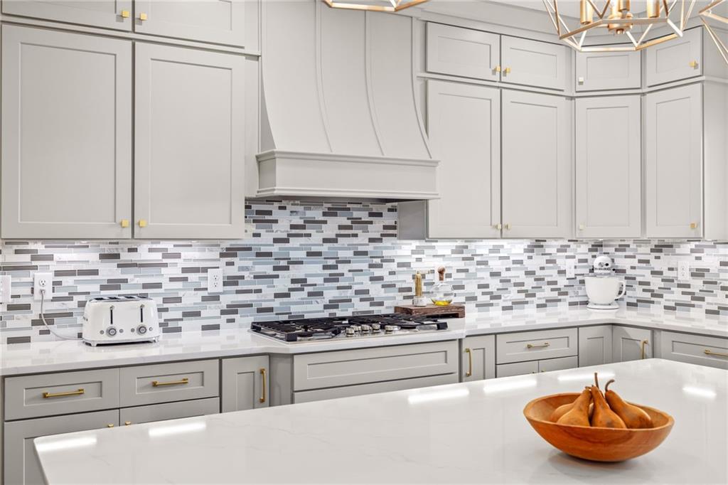 815 North Hampton Way Monroe, GA 30656 - Photo 21 of 89 a kitchen with stainless steel appliances granite countertop a sink a stove and a white wooden cabinets