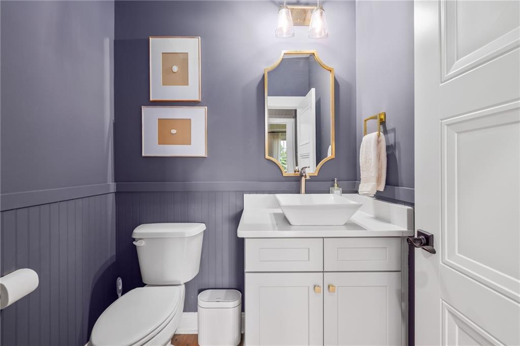 815 North Hampton Way Monroe, GA 30656 - Photo 32 of 89 a bathroom with a toilet sink and mirror