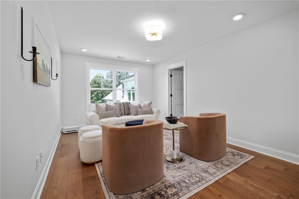 815 North Hampton Way Monroe, GA 30656 - Photo 33 of 89 a living room with furniture a window and a table