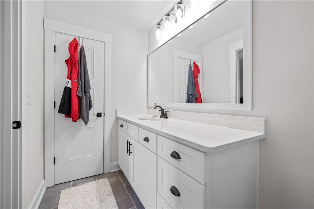 815 North Hampton Way Monroe, GA 30656 - Photo 36 of 89 a bathroom with a sink vanity and a mirror