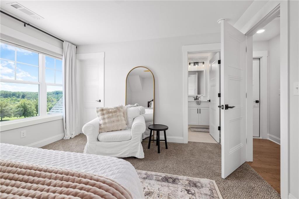 815 North Hampton Way Monroe, GA 30656 - Photo 39 of 89 a bedroom with a bed and a large window