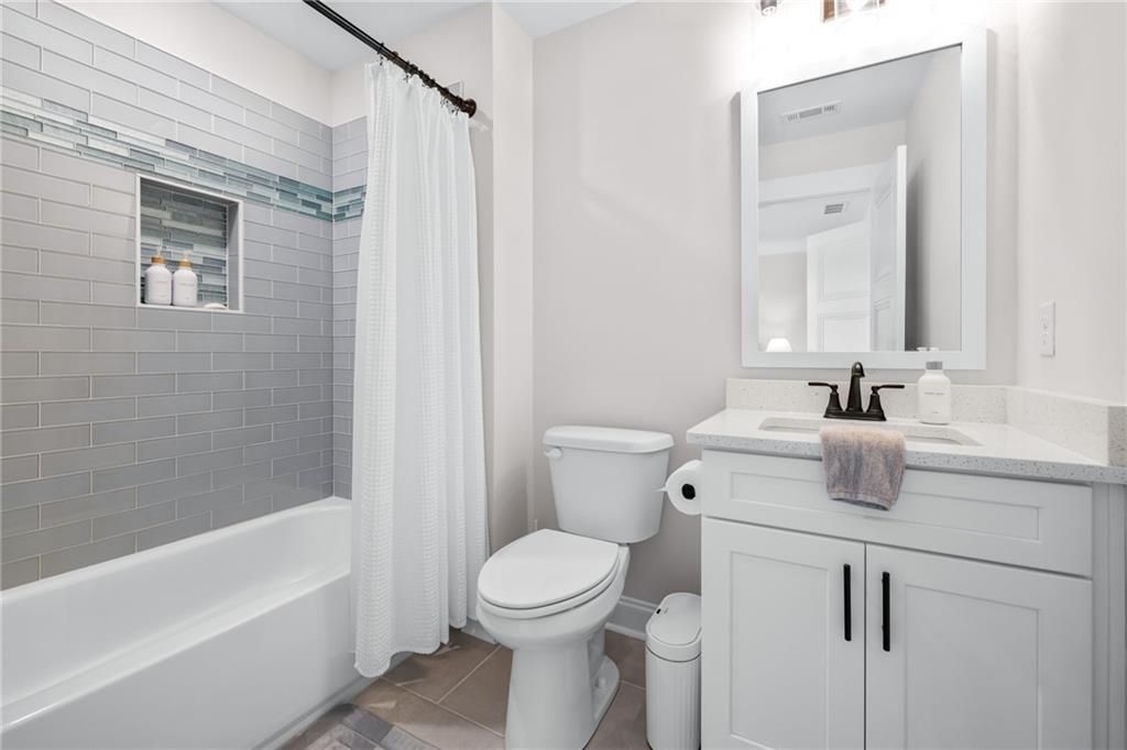 815 North Hampton Way Monroe, GA 30656 - Photo 40 of 89 a bathroom with a sink toilet and shower