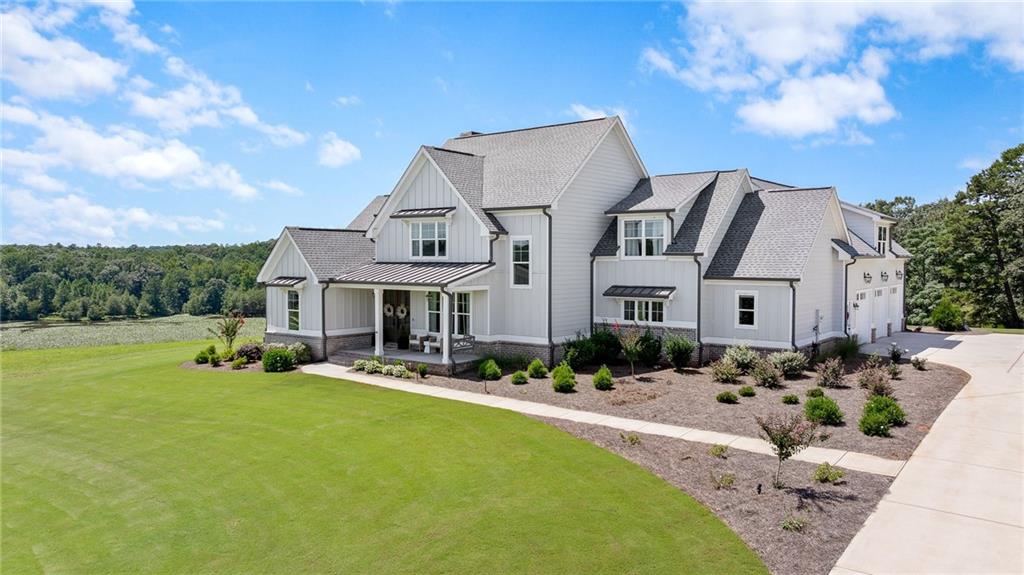 815 North Hampton Way Monroe, GA 30656 - Photo 4 of 89 a front view of house with yard outdoor seating and barbeque oven