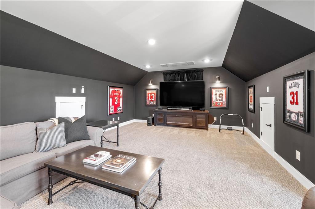 815 North Hampton Way Monroe, GA 30656 - Photo 47 of 89 a living room with furniture and a flat screen tv