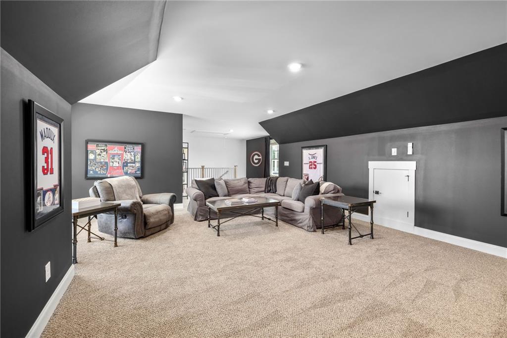 815 North Hampton Way Monroe, GA 30656 - Photo 48 of 89 a living room with furniture and a flat screen tv