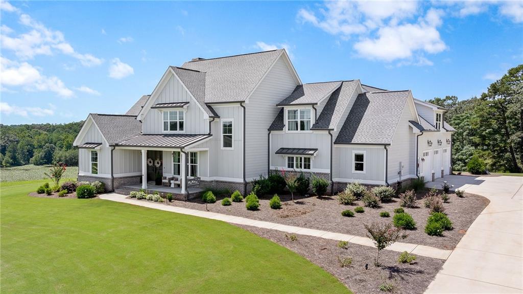 815 North Hampton Way Monroe, GA 30656 - Photo 5 of 89 a front view of house with yard outdoor seating and green space