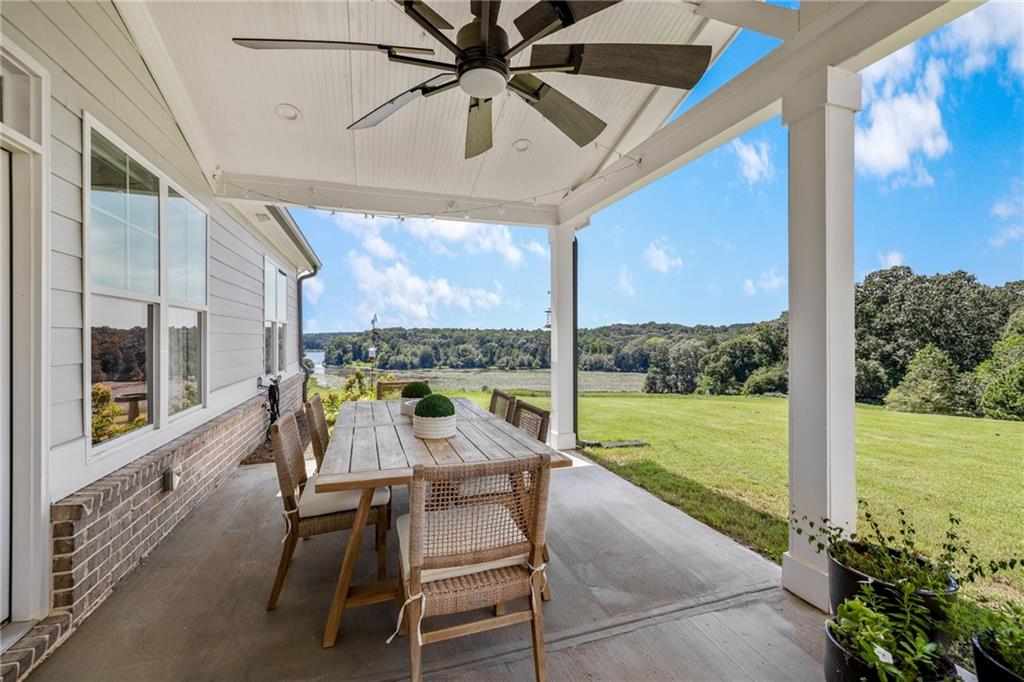 815 North Hampton Way Monroe, GA 30656 - Photo 51 of 89 a view of a porch with furniture and a yard