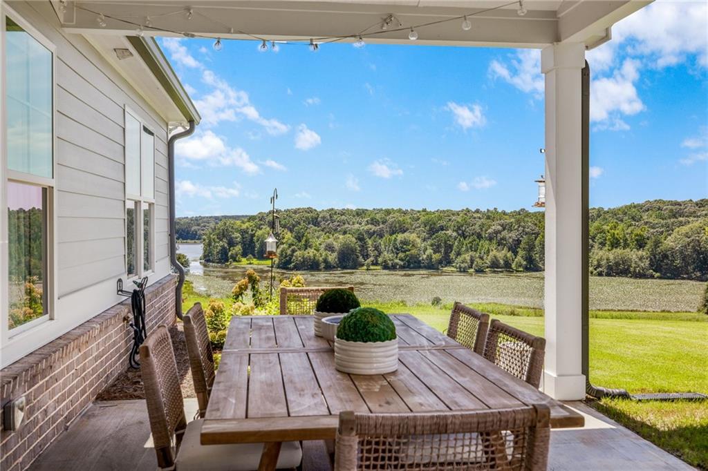 815 North Hampton Way Monroe, GA 30656 - Photo 52 of 89 a view of a balcony with chair and wooden floor