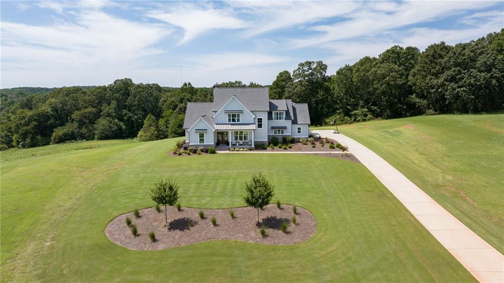 815 North Hampton Way Monroe, GA 30656 - Photo 63 of 89 a view of a house with a swimming pool
