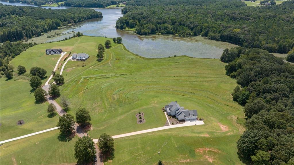 815 North Hampton Way Monroe, GA 30656 - Photo 79 of 89 a view of a swimming pool with a yard