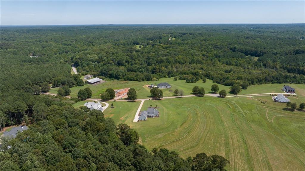 815 North Hampton Way Monroe, GA 30656 - Photo 82 of 89 an aerial view of residential houses with outdoor space and trees